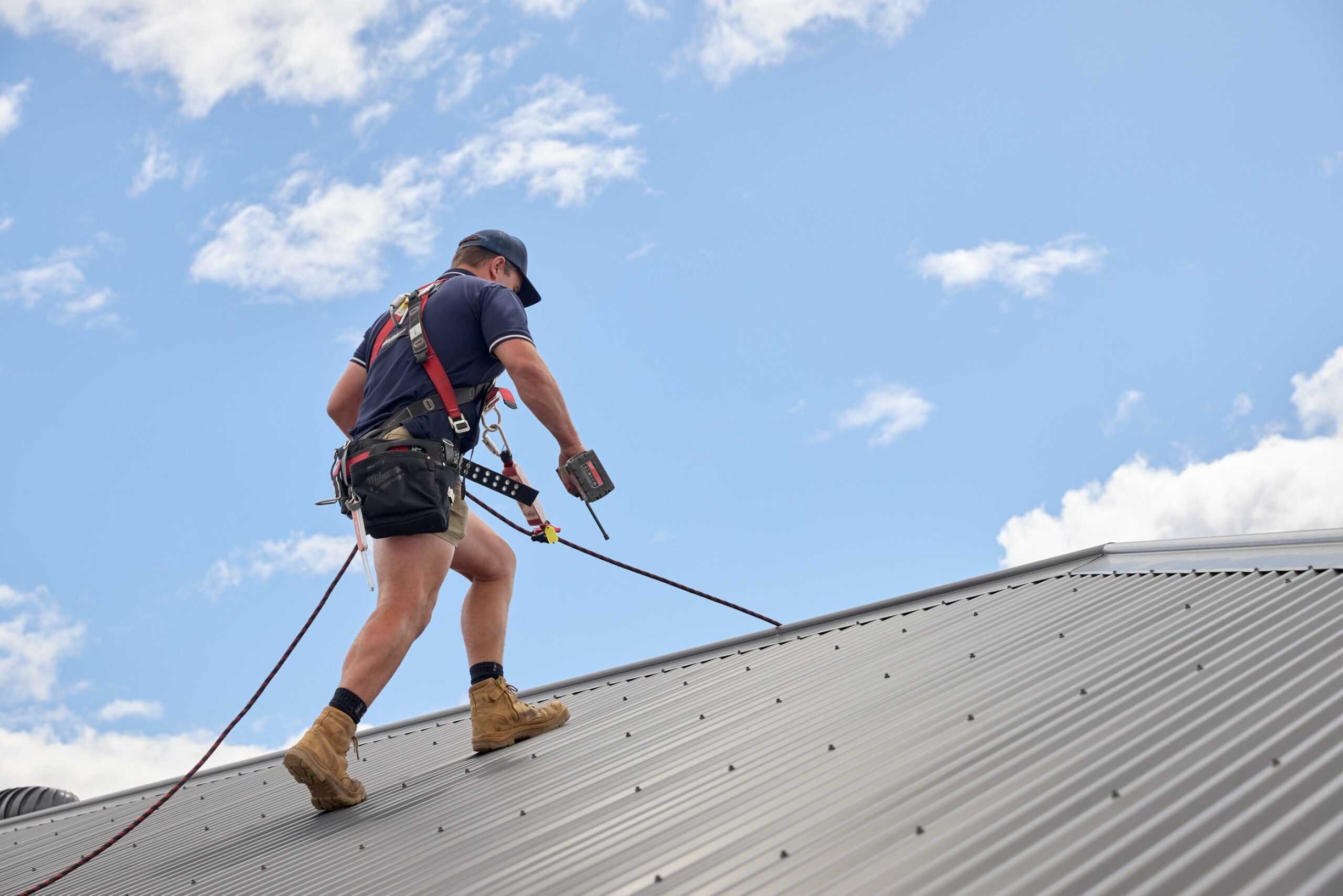 A Tonkin Group employee working on a roofing project.